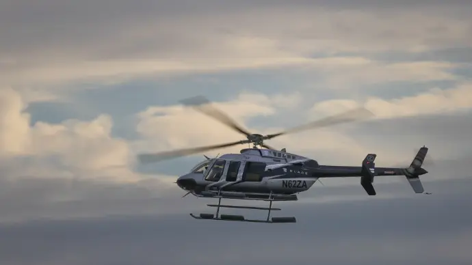 Helicopter flying at sun set